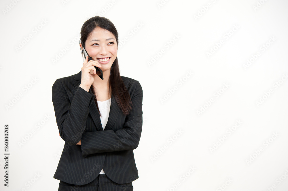 asian businesswoman talking by cellphone asian businesswoman talking by cellphone