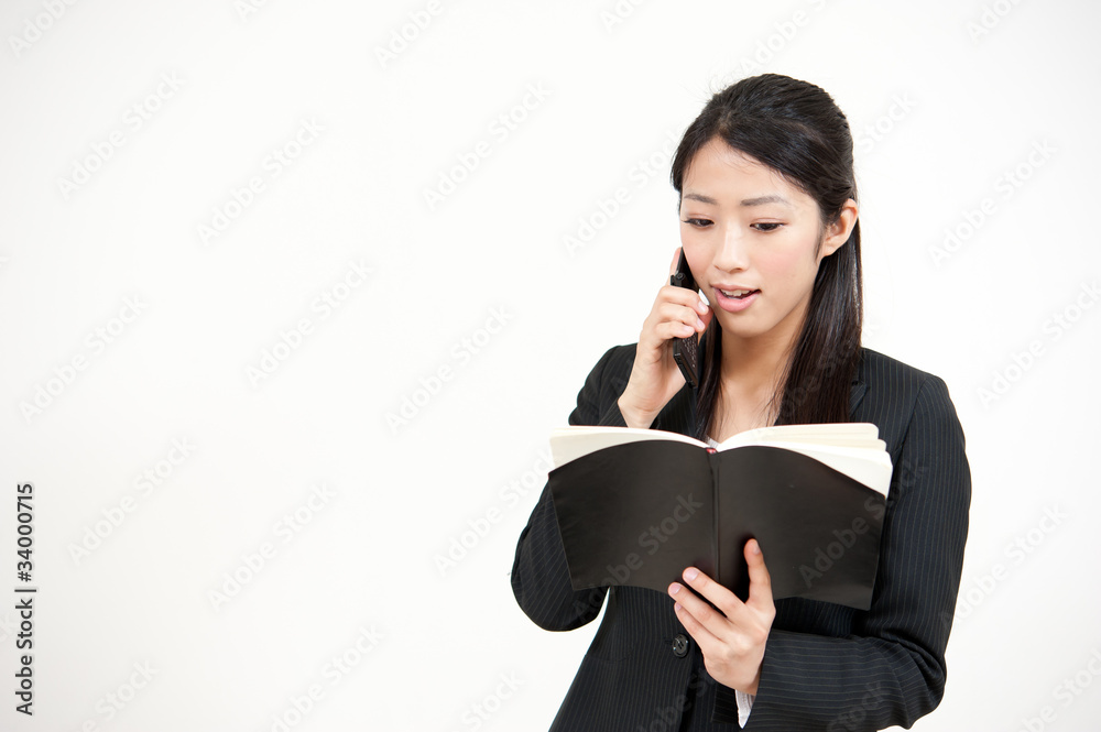 asian businesswoman talking by cellphone asian businesswoman talking by cellphone
