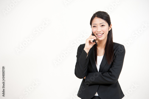 asian businesswoman talking by cellphone