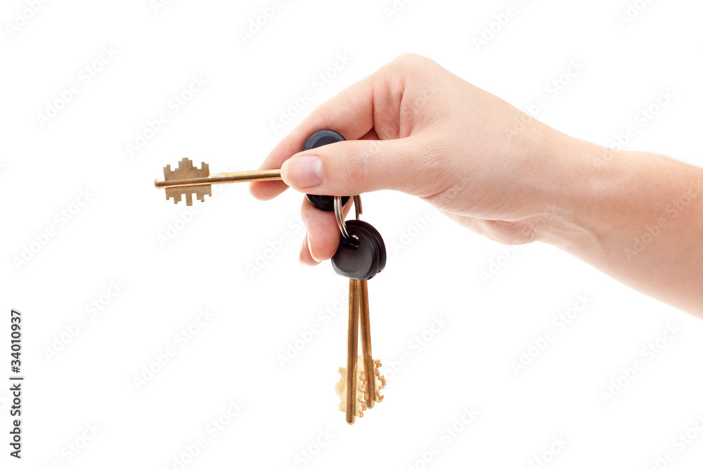 Human hand with house keys isolated on white background Human hand with house keys isolated on white background