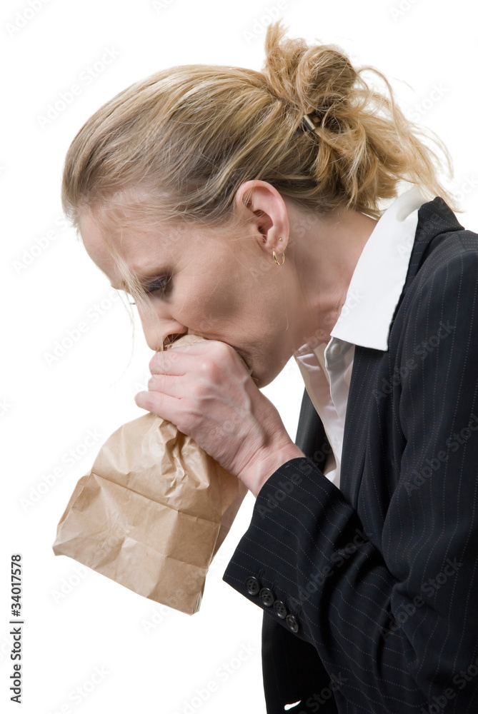 woman breathing into a brown paper bag Stock Photo | Adobe Stock