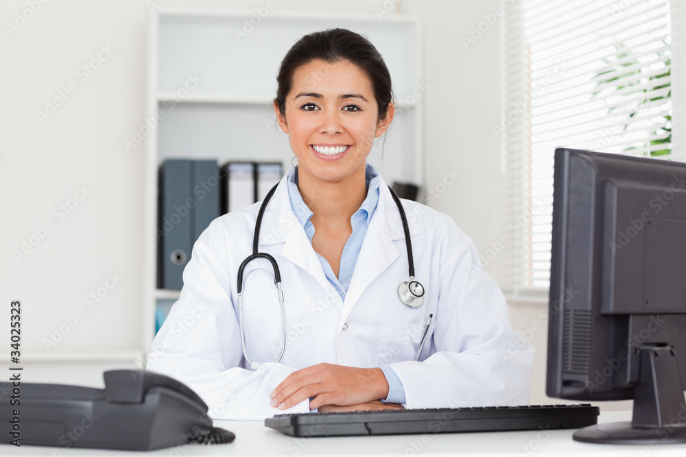 Pretty woman doctor with a stethoscope posing Pretty woman doctor with a stethoscope posing