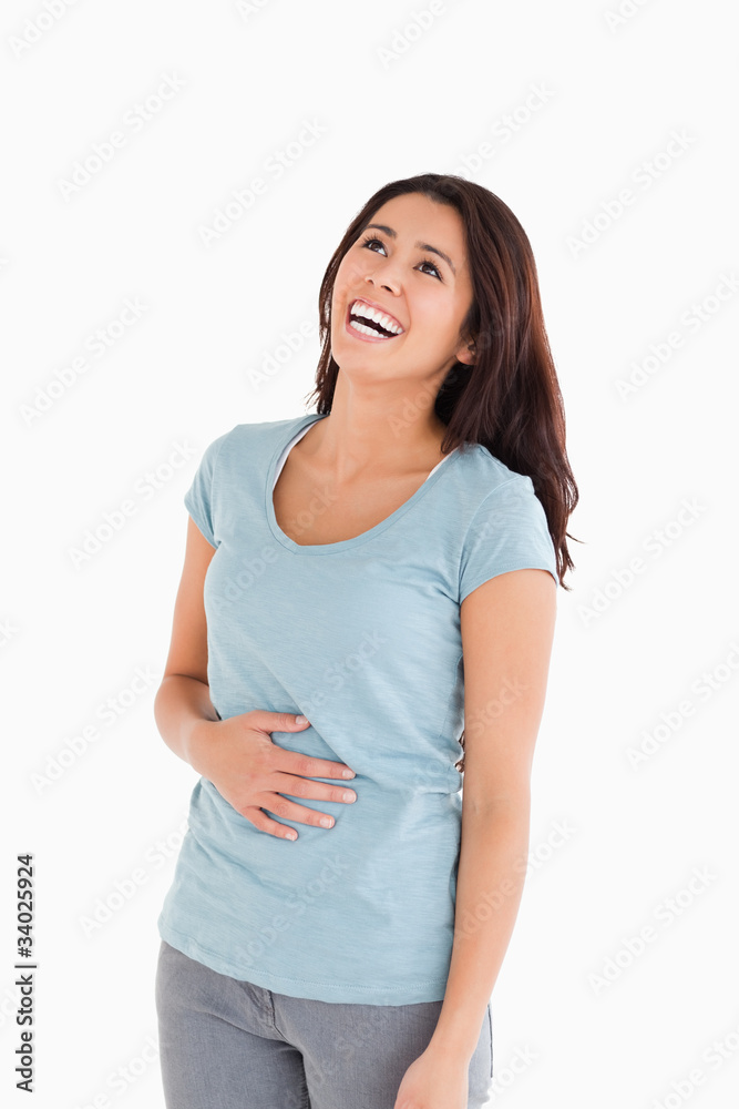 Fototapeta premium Joyful beautiful woman laughing while standing