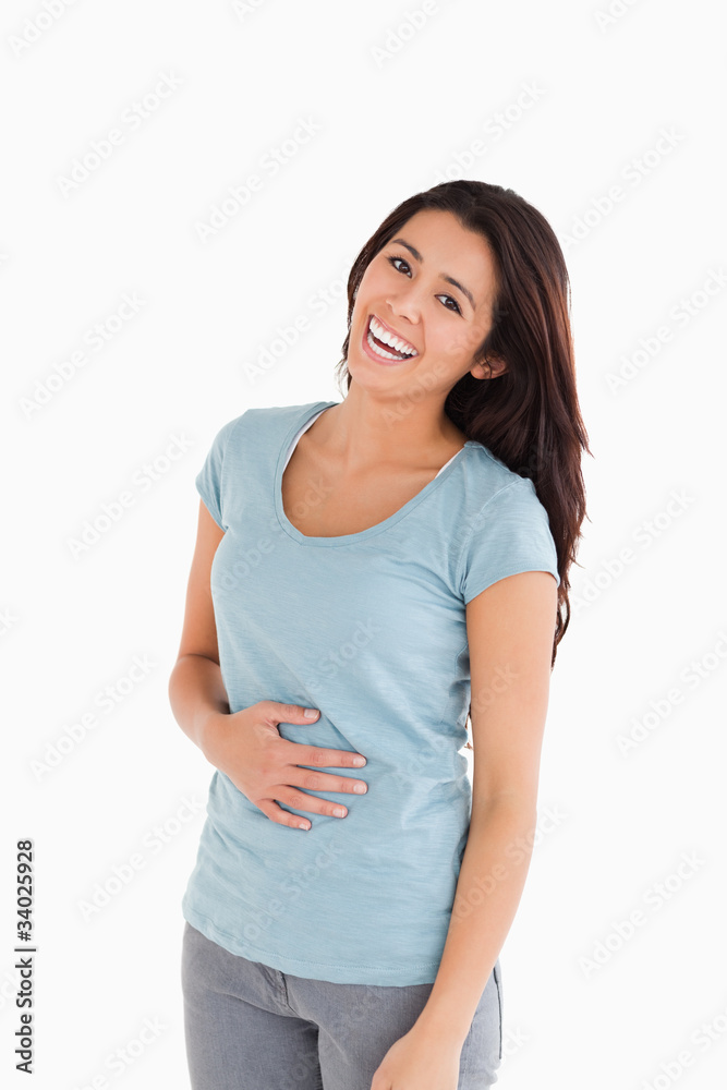 Cheerful beautiful woman laughing while standing Cheerful beautiful woman laughing while standing