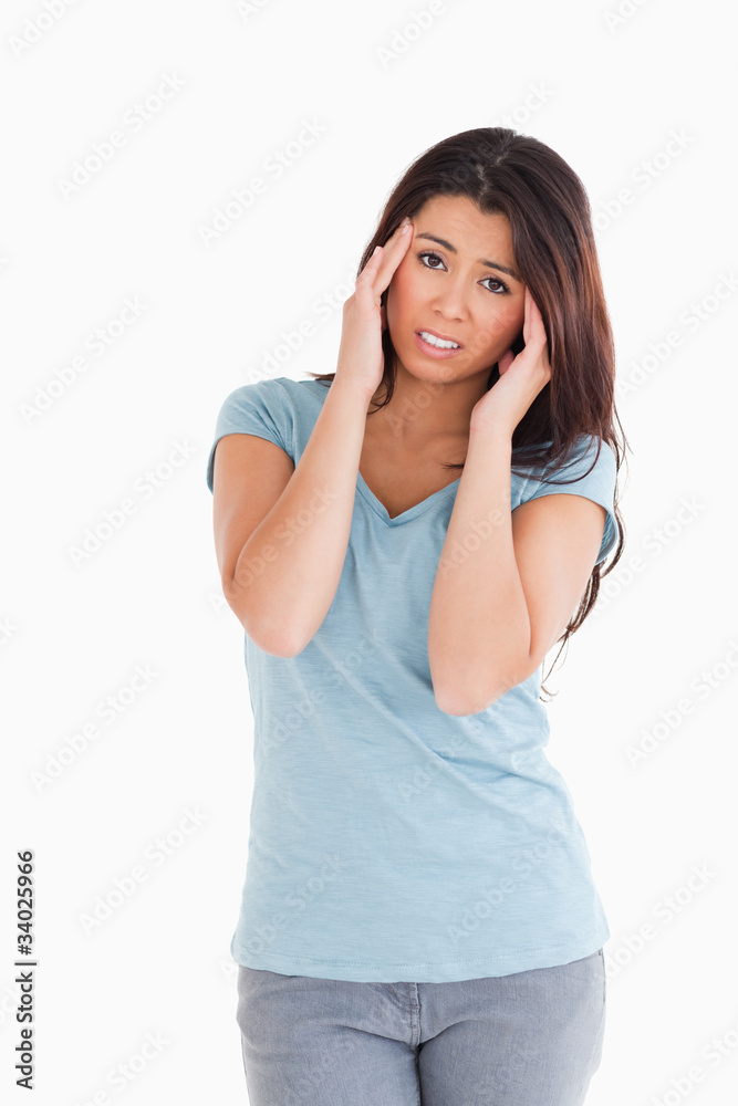 Gorgeous woman having a headache while standing Gorgeous woman having a headache while standing