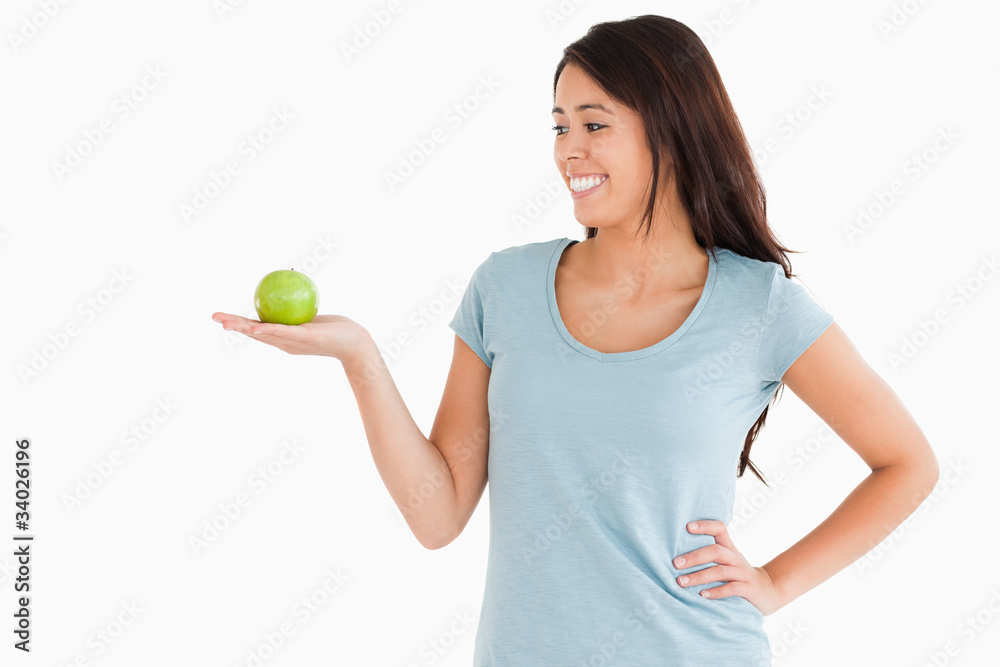 Beautiful woman holding a green apple Beautiful woman holding a green apple