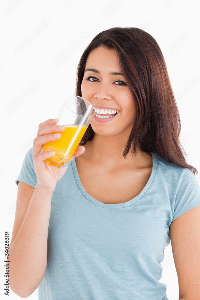 Beautiful woman drinking a glass of orange juice Beautiful woman drinking a glass of orange juice