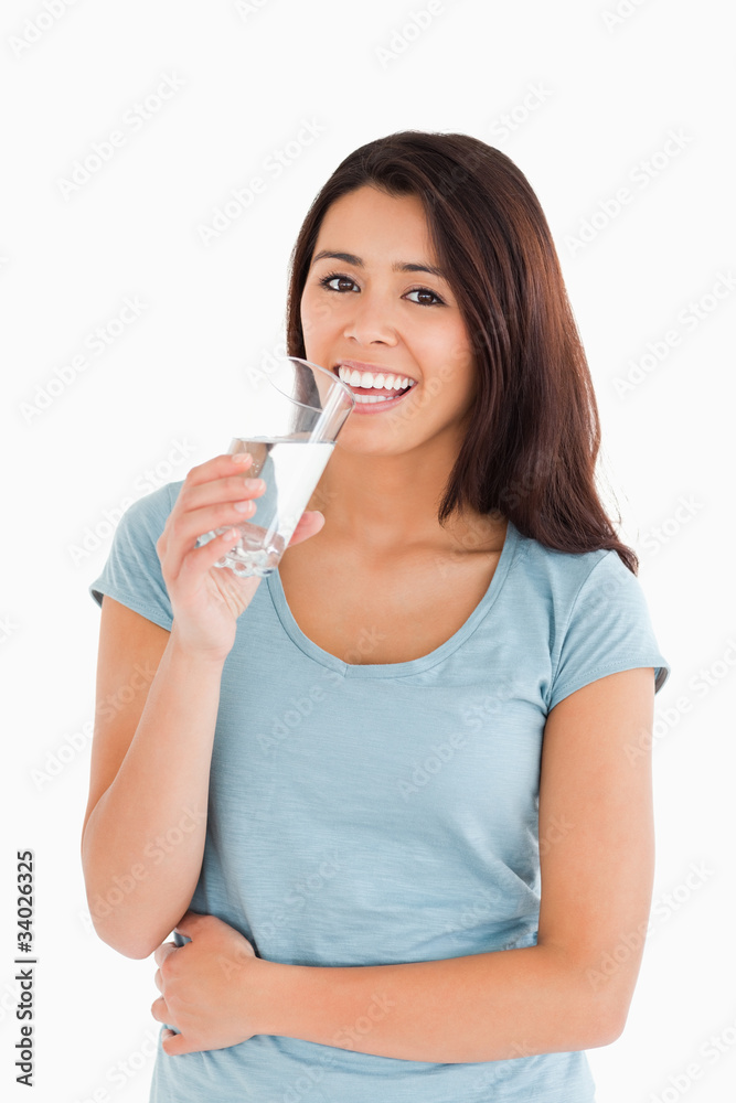 Gorgeous woman drinking a glass of water Gorgeous woman drinking a glass of water