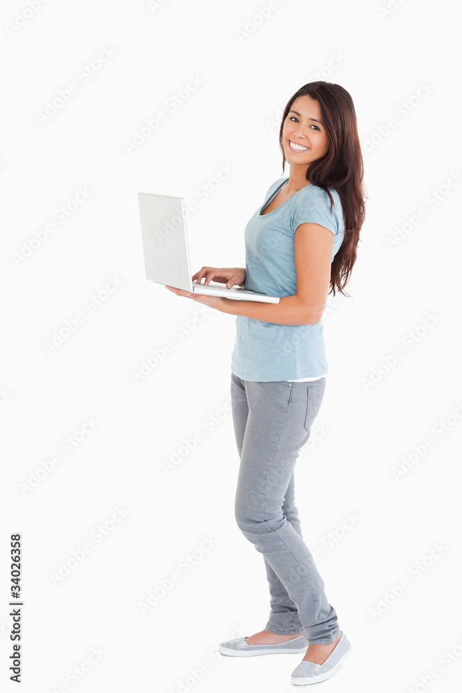 Attractive woman relaxing with her laptop Attractive woman relaxing with her laptop