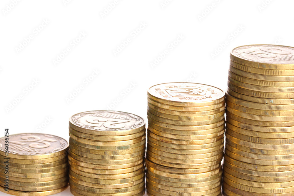 Many coins in column isolated on white Many coins in column isolated on white