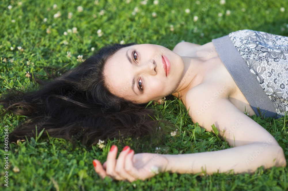 Woman lying on the grass
