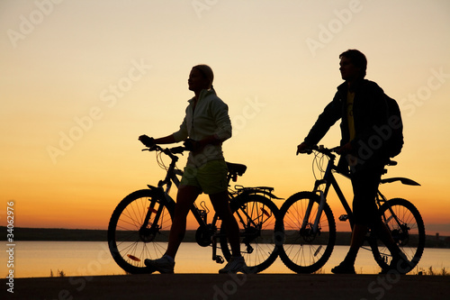 Couple of bicycles on sunset © yanlev