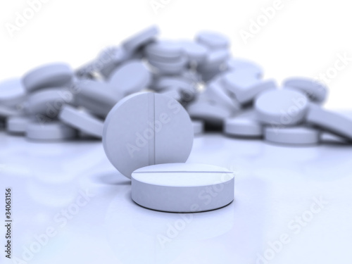 close-up medical pills on blue surface