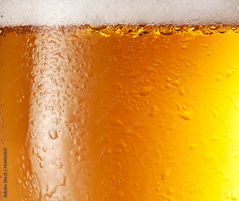 Drop and foam of beer as background. Drop and foam of beer as background.