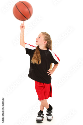 Proud Girl Child Basketball Player Spinning Ball on Finger © Ixepop