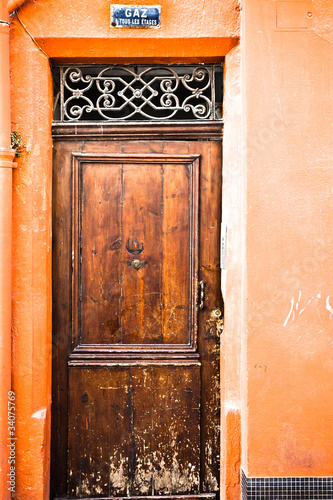 wooden door on orange wall