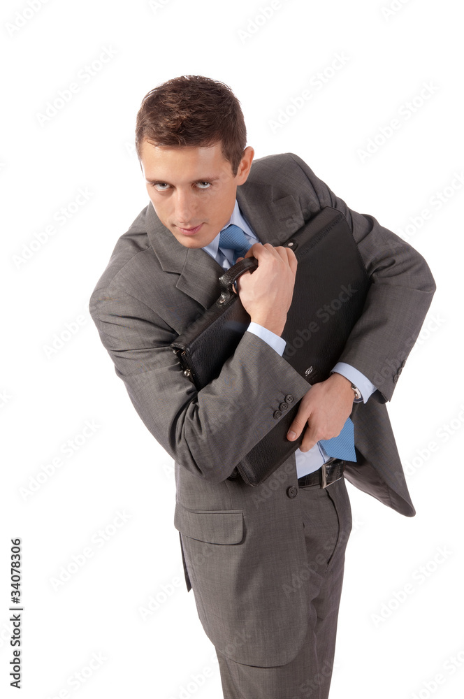 young businessman embraces a portfolio with fear young businessman embraces a portfolio with fear