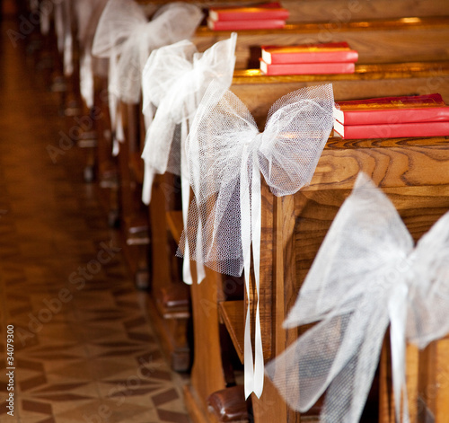 White bows in Catholic Church.