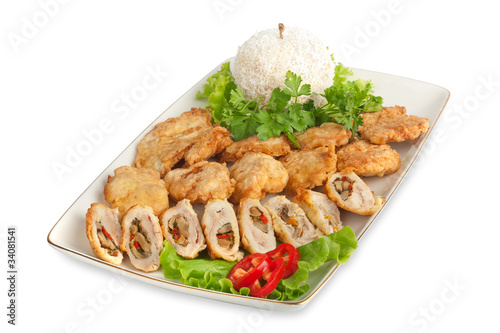 Appetizer of meat with lettuce, pepper and vegetables