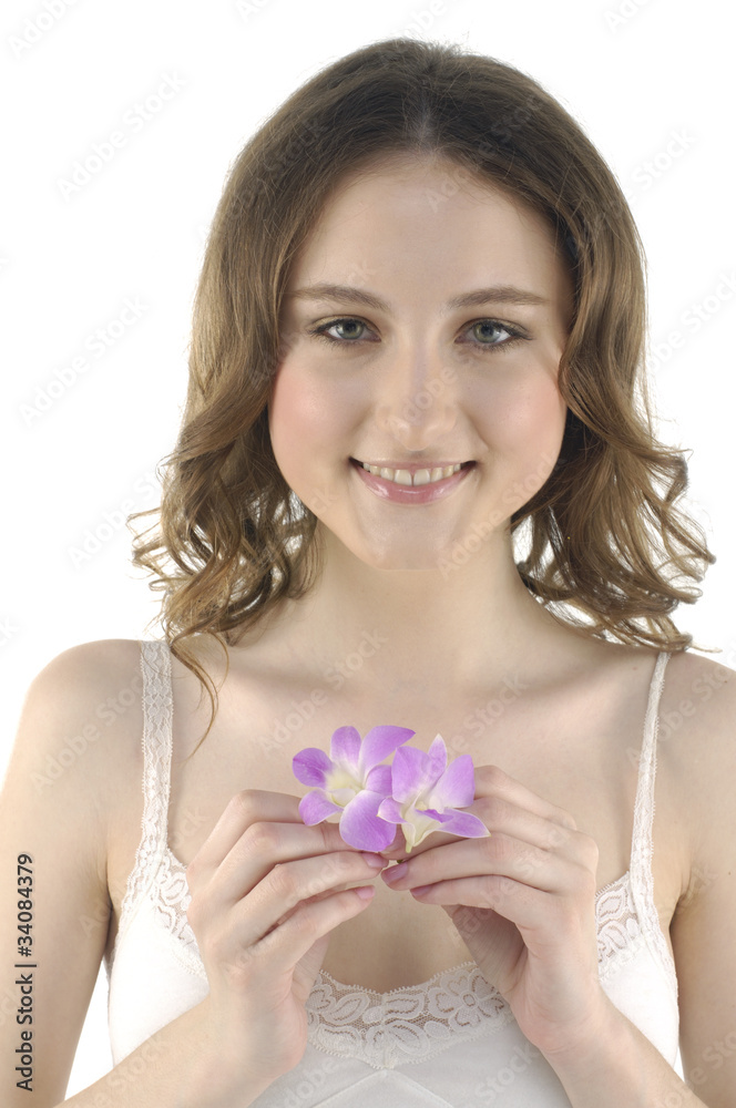 Close up beautiful girl holding orchid flower in her hands
