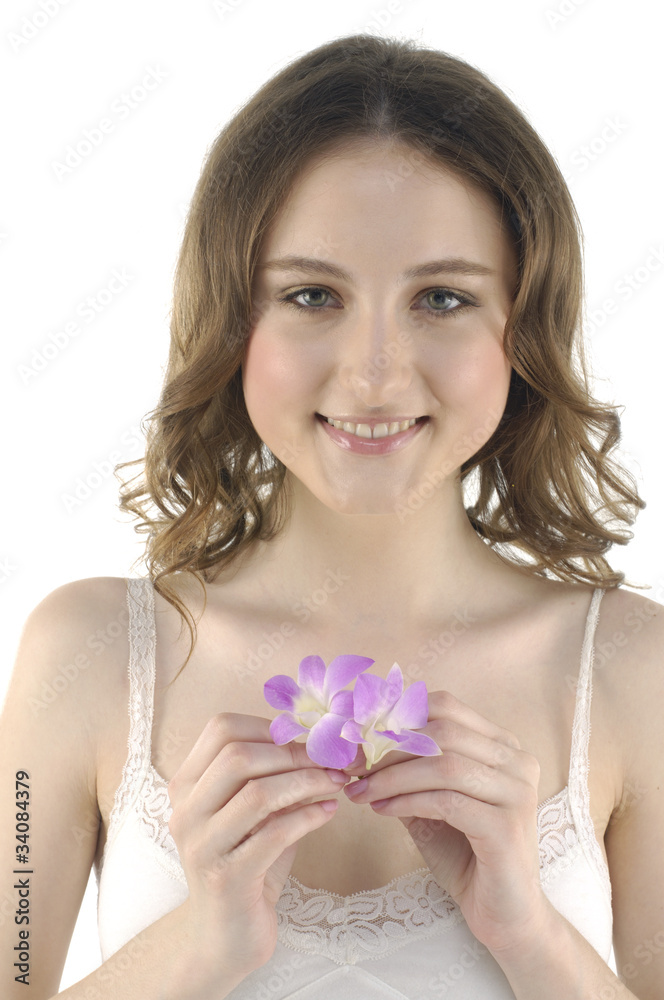 Close up beautiful girl holding orchid flower in her hands Close up beautiful girl holding orchid flower in her hands
