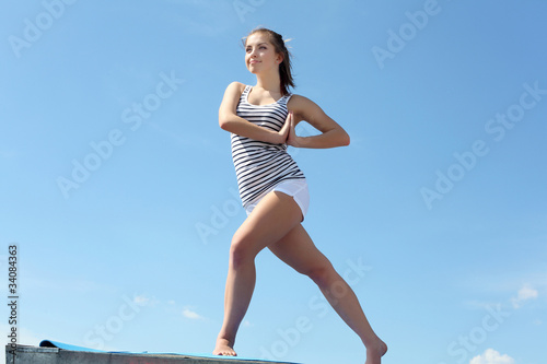 Portrait of a young woman doing exercises
