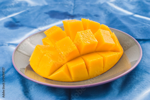 Fresh delicious mango fruit in dish