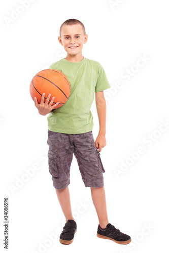Child with basketball isolated on white background © Xalanx