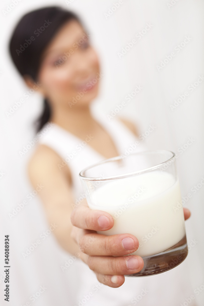 Asian Chinese Girl Holding Glass of Milk to Camera Asian Chinese Girl Holding Glass of Milk to Camera
