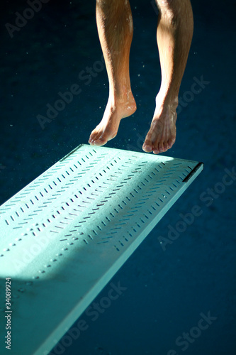 feet jumping on springboard