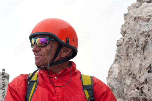 Rock climber with helmet. Dolomites, Italy © pio3