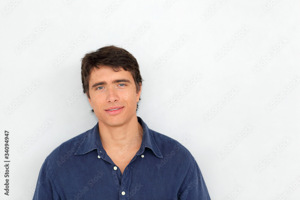 Portrait of young man standing on white background Portrait of young man standing on white background