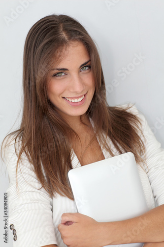 Portrait of beautiful young woman with electronic tablet