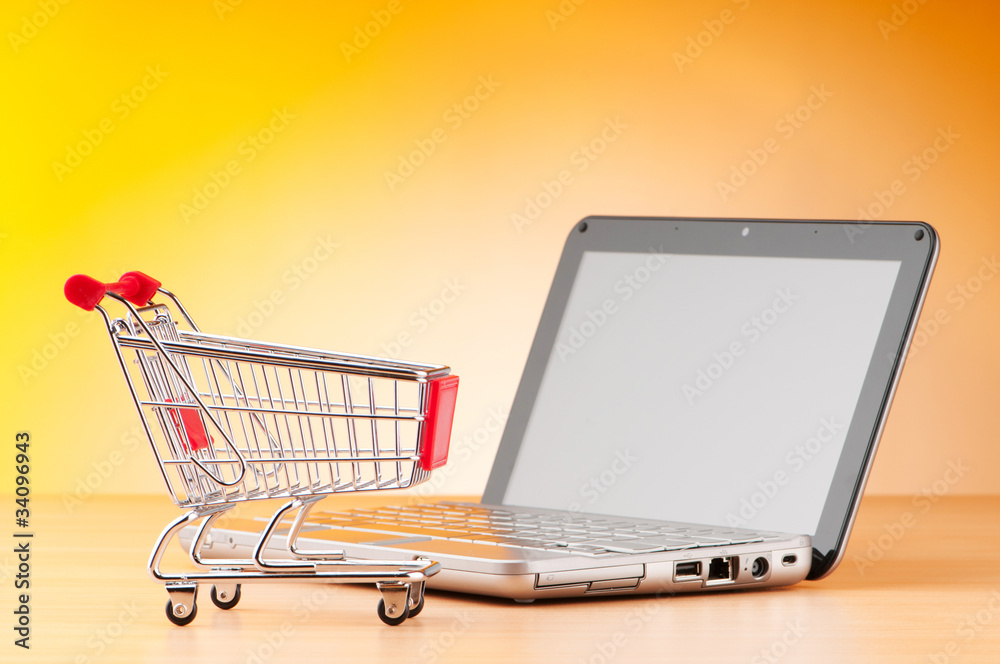 Internet online shopping concept with computer and cart Internet online shopping concept with computer and cart