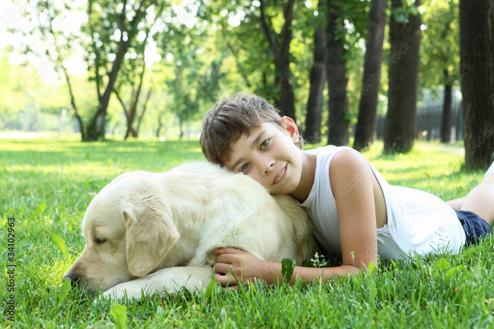 Little boy in the park with a dog Little boy in the park with a dog
