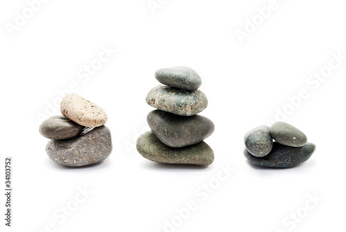 A few stones of different sizes, isolated on white.