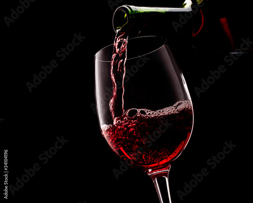 Red wine on a black background