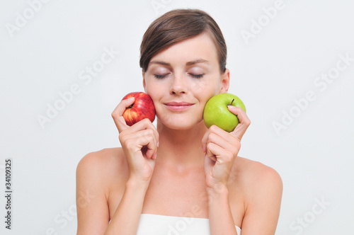 Beautiful woman with green and red apples