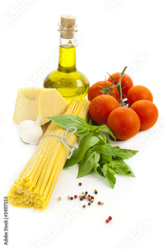 Ingredients for Italian cooking: olive oil, basil, tomato, parme