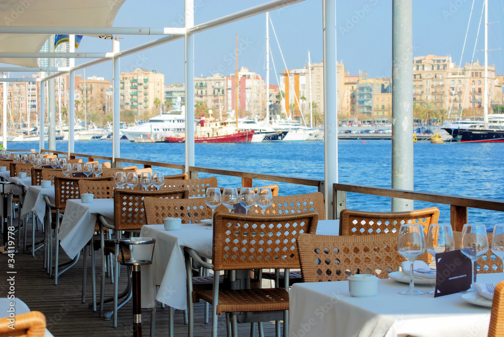 Naklejka premium restaurant on quay of port of barcelona, Port Well, spain