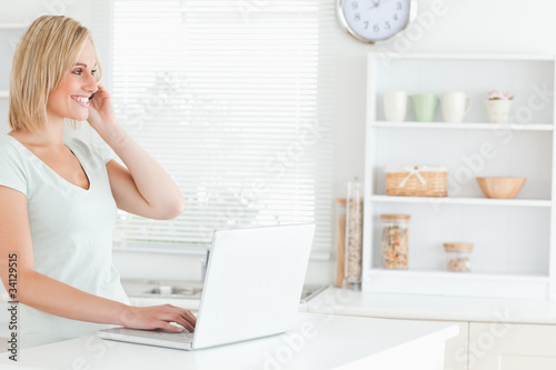 Woman with laptop and phone © WavebreakmediaMicro