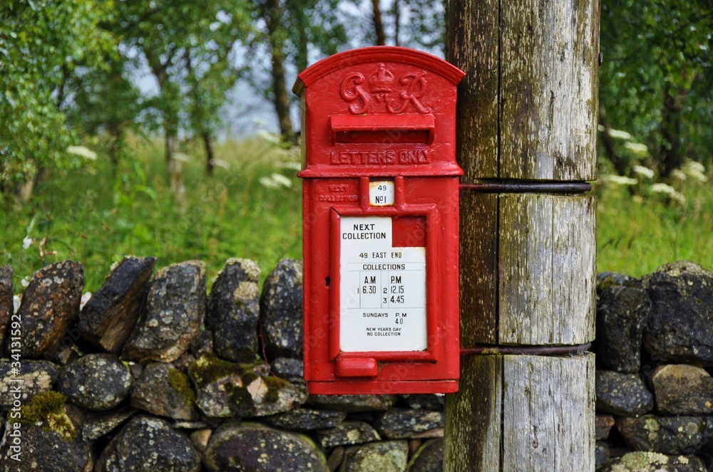 Traditional english postbox in countryside Traditional english postbox in countryside