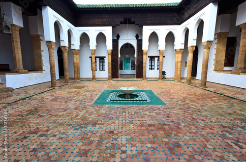 Interior tiled courtyard and fountain of madrasa