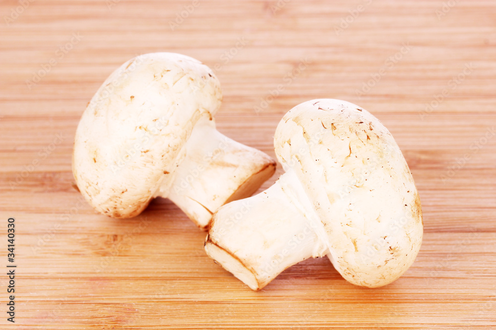 Champignon on wooden background Champignon on wooden background