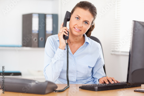Wallpaper Mural Telephoning businesswoman in office Torontodigital.ca