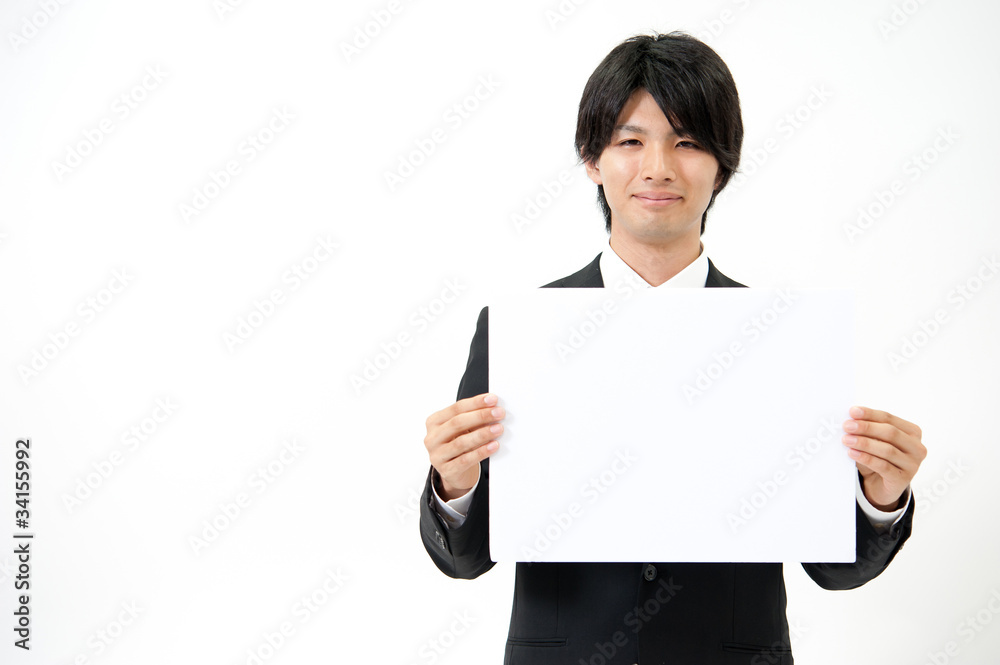 young bisinessman holding a whiteboard young bisinessman holding a whiteboard