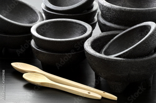 plastic molcajetes and wood spoons photo