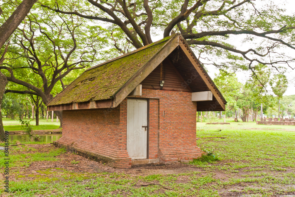 Brick hut in park close up tilted Brick hut in park close up tilted