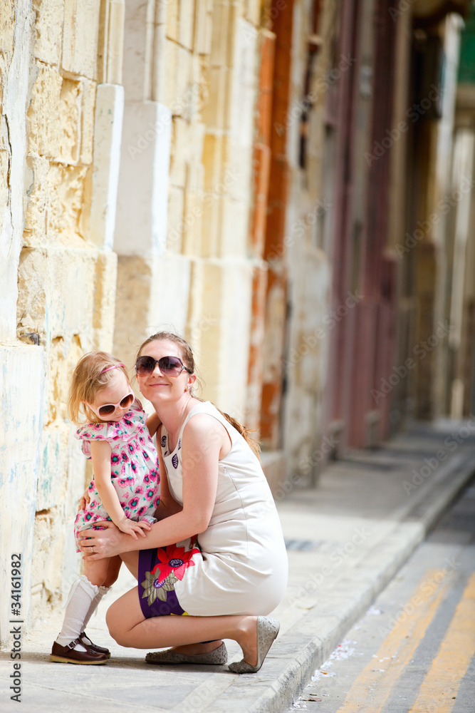 Mother and daughter portrait outdoors
