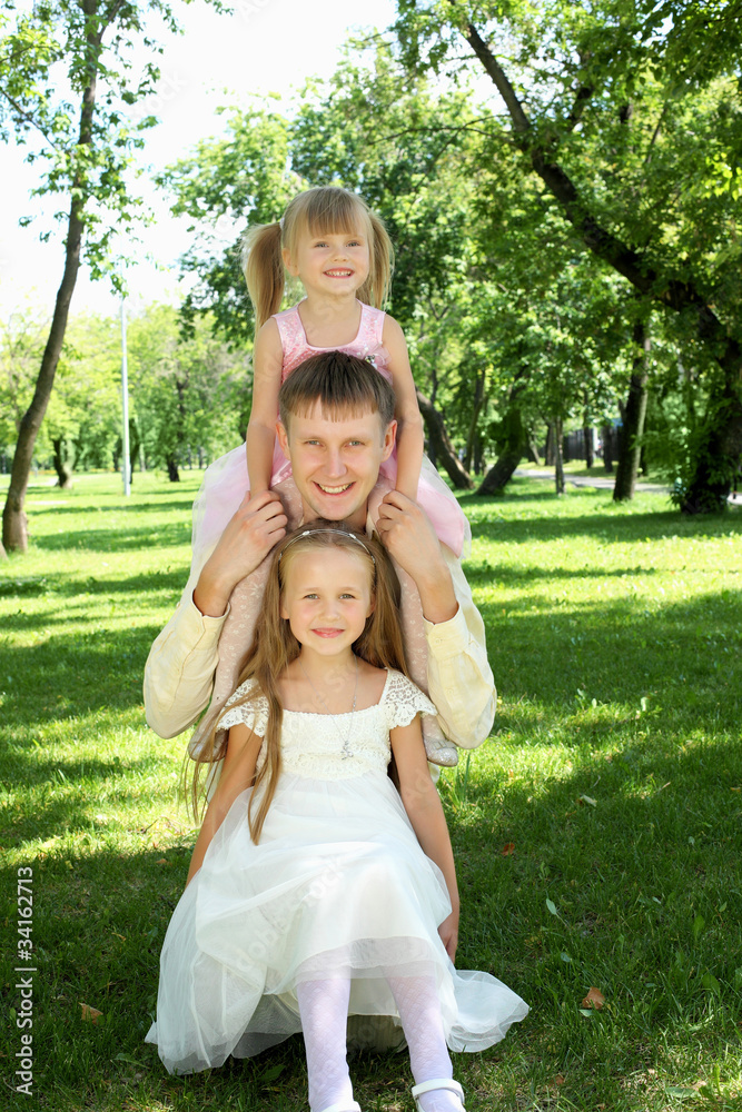 Father with two daugthers outside Father with two daugthers outside